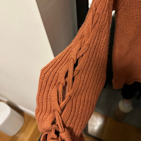 Orange knit sweater with ties on arms - Picture 3 of 3